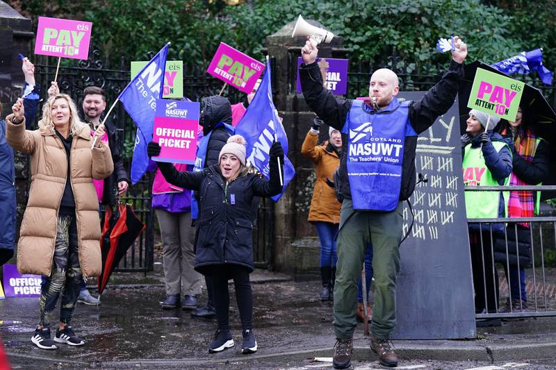 Primary school teachers on a picket line in Glasgow this month. Teachers in England and Wales have now voted for their own walk out. PA