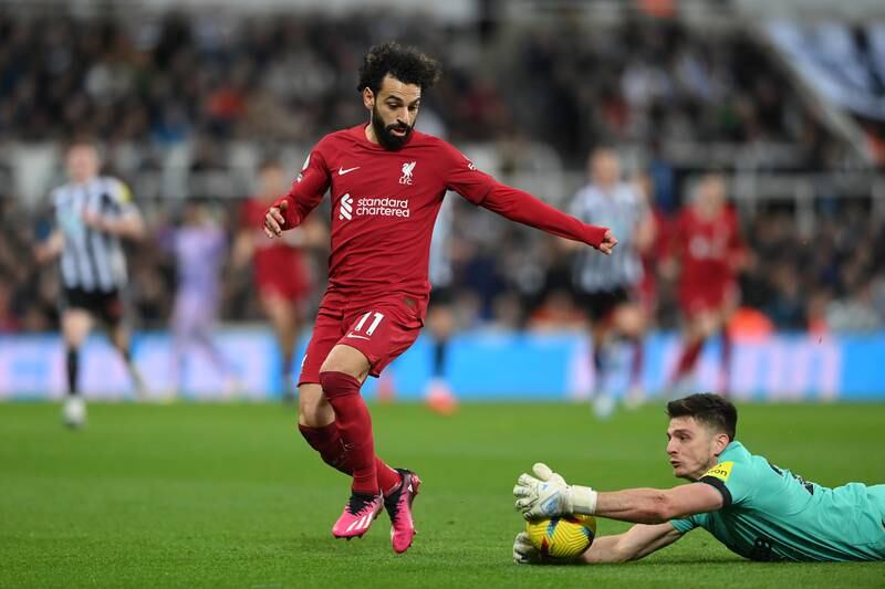 Liverpool's Mohamed Salah watches as Newcastle goalkeeper Nick Pope handles the ball outside the area, which results in a red card. Getty


