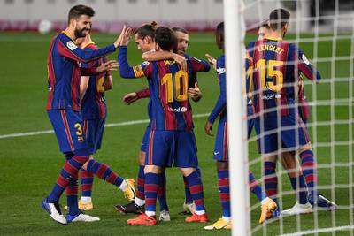 Barcelona celebrate Lionel Messi's goal against Real Betis at Camp Nou on Saturday. AFP