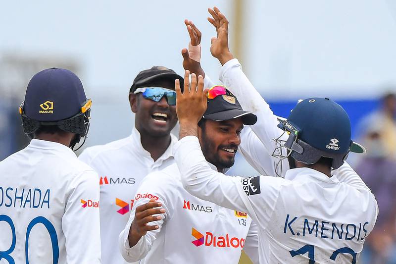 Sri Lanka's Dhananjaya de Silva celebrates with teammates after the dismissal of Pakistan's Agha Salman. AFP