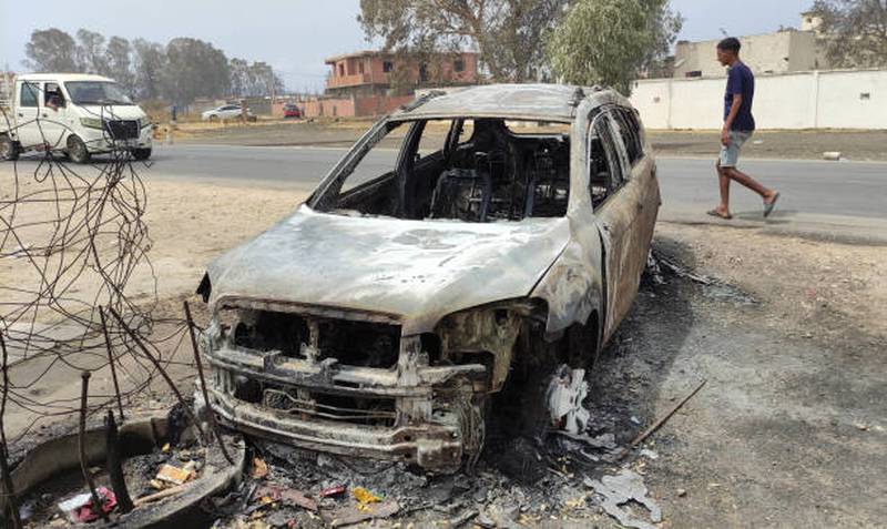 A burnt-out car in El Tarf district.  Getty Images