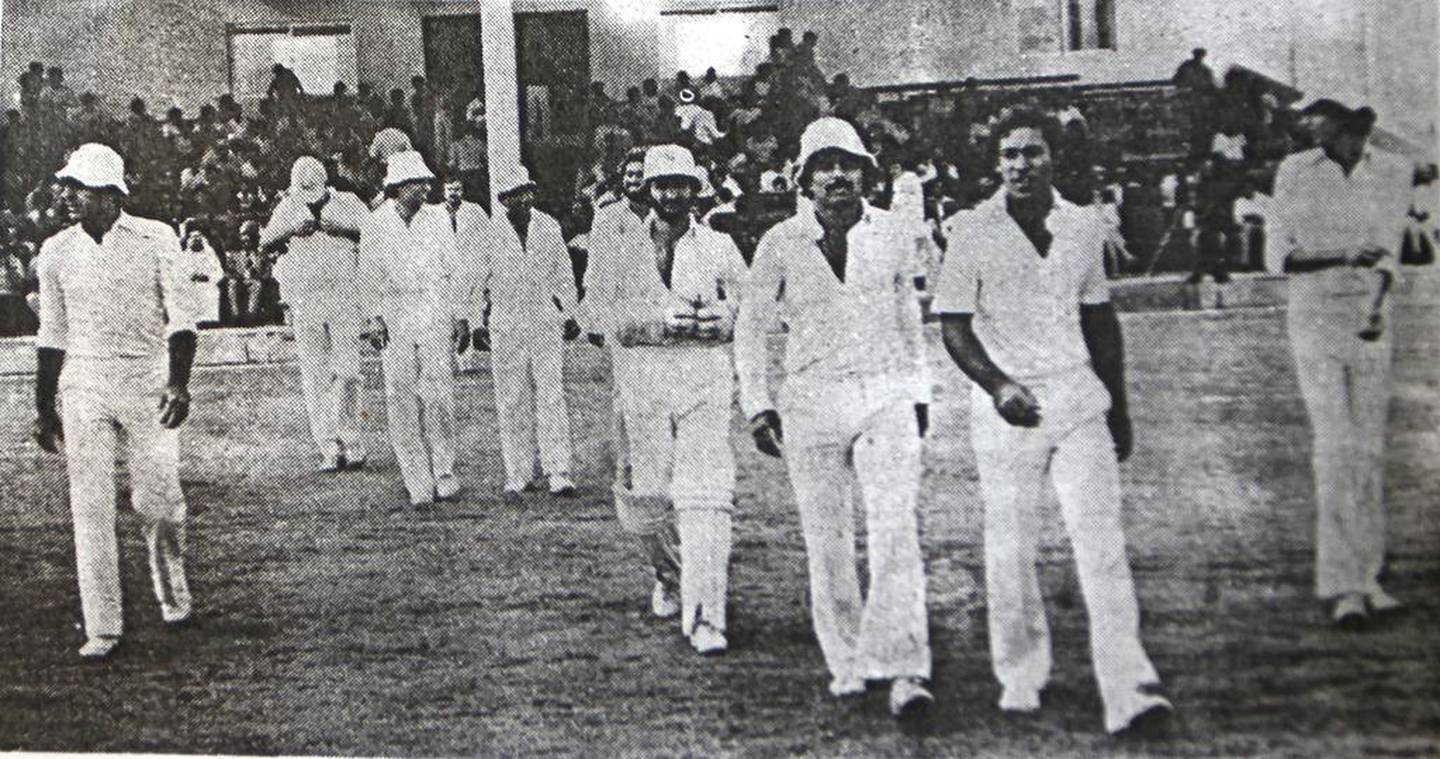 The Pakistan side, led by Javed Miandad, takes the field during a match between Gavaskar XI and Miandad XI at Sharjah Cricket Stadium, April 3 1981. The Cricketer Pakistan
