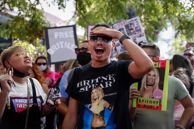 Britney fan Brian Molina celebrates upon hearing the news that Superior Judge Brenda Penny suspended her father Jamie from the conservatorship that controlled her money and life for 13 years. EPA