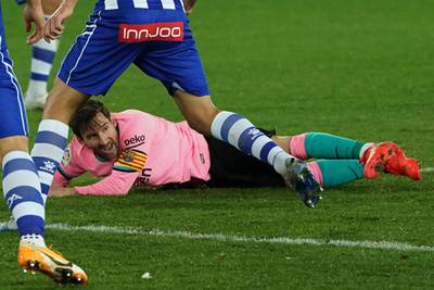 Messi takes a tumble. AFP