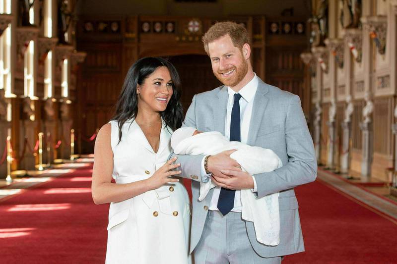 Prince Harry and Meghan pose during a photocall with their newborn son Archie, in St George's Hall at Windsor Castle in May 2019. AP Photo