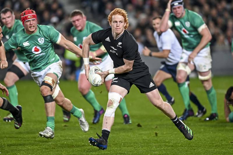 New Zealand's Finlay Christi runs at the Ireland defence. AP