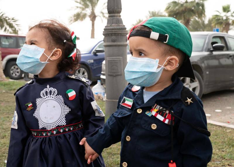 Kuwaiti kids wear protective face masks, following the outbreak of coronavirus, during celebrations of the 29th Kuwait Liberation Day.  Reuters