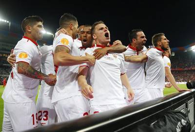 Sevilla players celebrate. Michael Dalder / Reuters