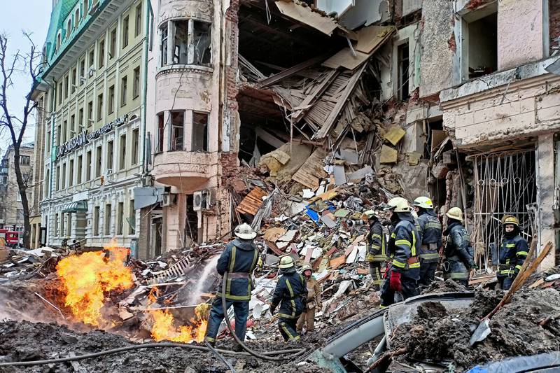 Rescuers work at a building damaged by an air strike, in central Kharkiv, Ukraine. Reuters