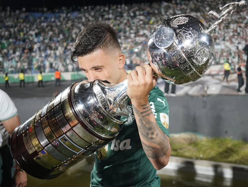 Palmeiras' Victor Luis kisses the Copa Libertadores trophy. Reuters