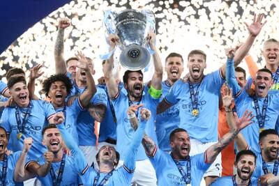 Manchester City lifts the Champions League trophy after the team's victory over Inter Milan. Getty