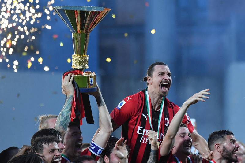 Zlatan Ibrahimovic and teammates celebrate with the Serie a trophy. AFP