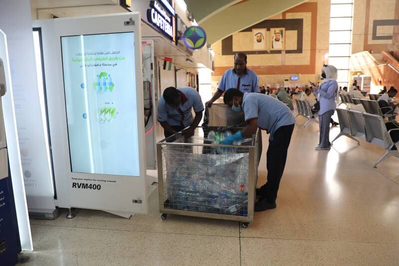 Commuters get points each time they deposit plastic bottles in a reverse-vending machine installed at Abu Dhabi’s main bus terminal. Nilanjana Gupta / The National