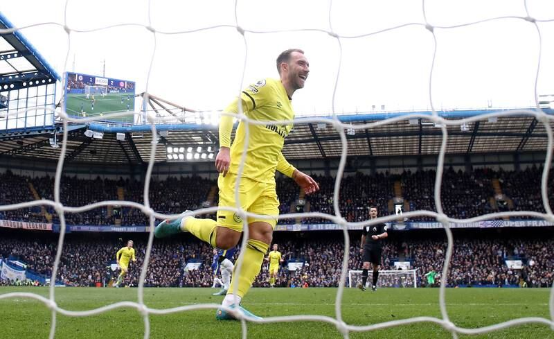 LONDON, ENGLAND - APRIL 02: Christian Eriksen of Brentford celebrates their sides third goal scored by Vitaly Janelt during the Premier League match between Chelsea and Brentford at Stamford Bridge on April 02, 2022 in London, England. (Photo by Alex Pantling / Getty Images)