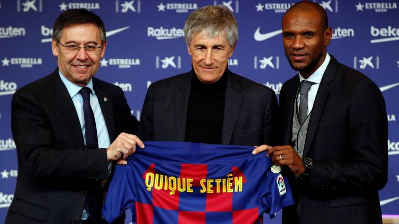 Barcelona's president Josep Maria Bartomeu, left, sports director Eric Abidal, right, with new manager Quique Setien. EPA