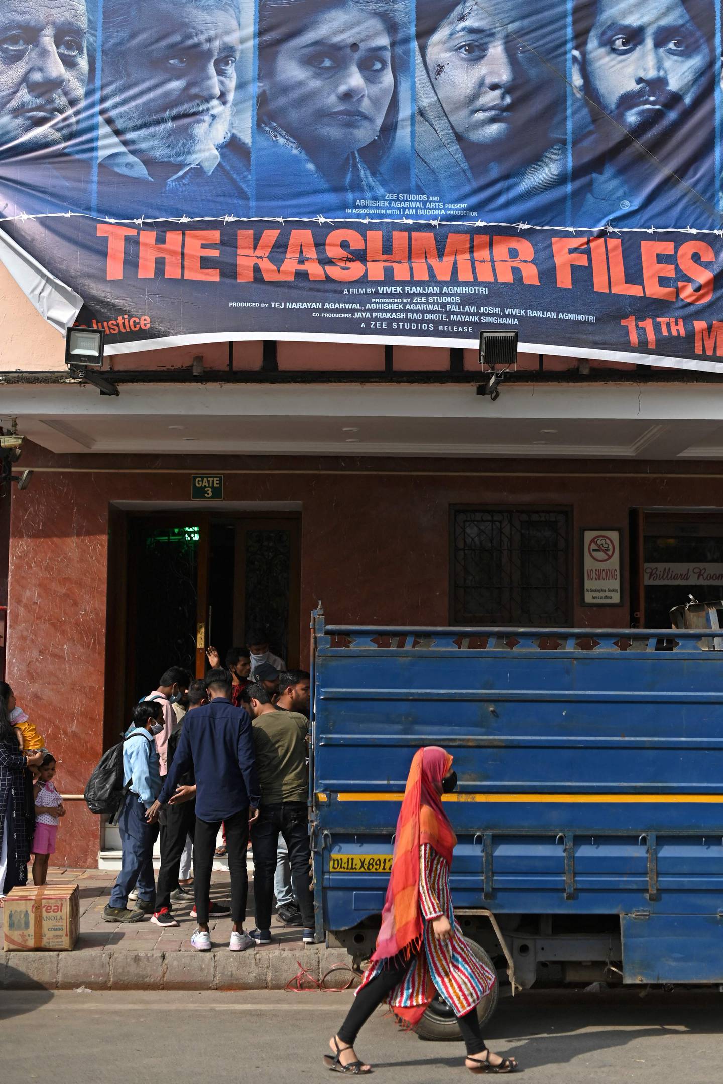 A banner for Bollywood movie 'The Kashmir Files' outside a cinema in the old quarters of Delhi. AFP