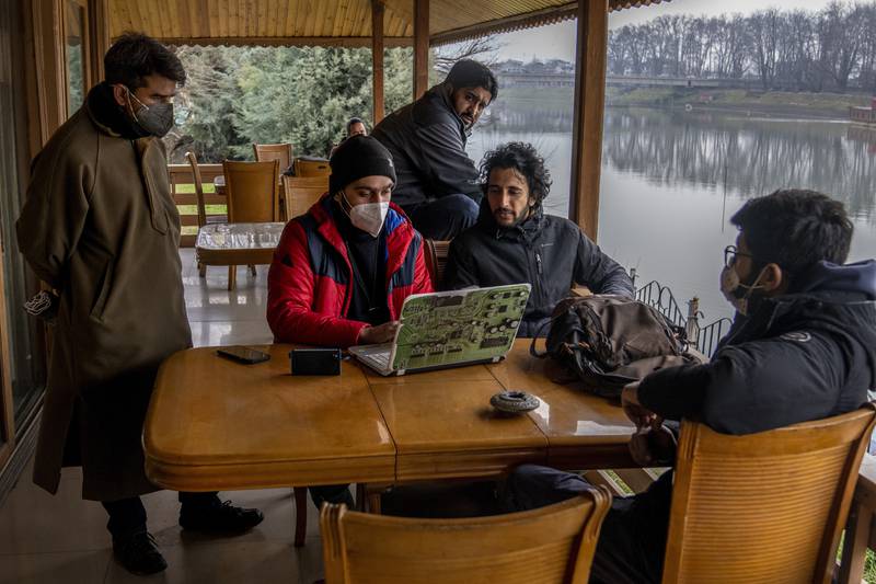 Journalists including Fahad Shah discuss the closure of the Kashmir Press Club building in Srinagar in January. AP