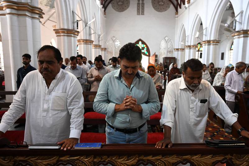 Christians take part in a Sunday prayer at the St John's Cathedral Church in Peshawar on Sunday, after mobs attacked Pakistani churches over blasphemy allegations. AFP