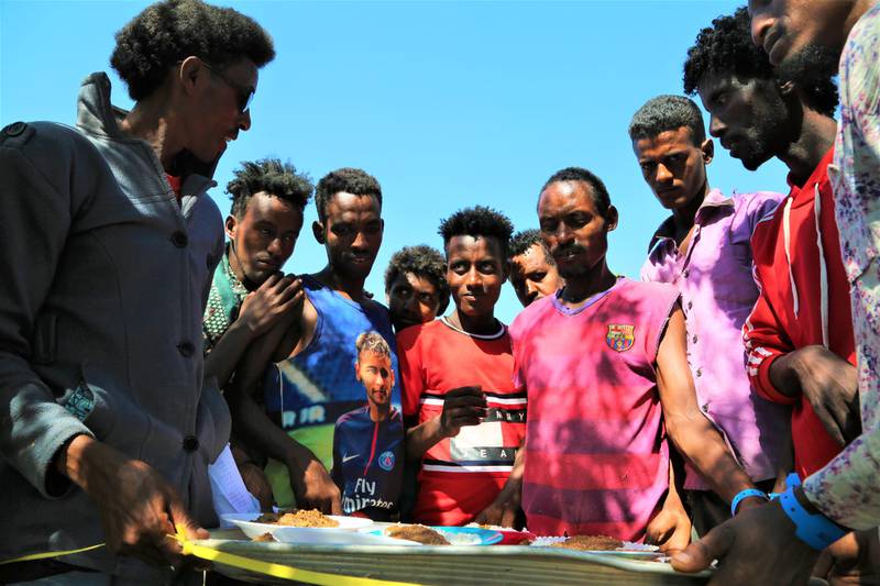 Ethiopians fleeing intense fighting in their homeland of Tigray, receive food in the neighbouring Sudanese Um Rakuba Refugee Camp, Gedaref State, Sudan.  EPA