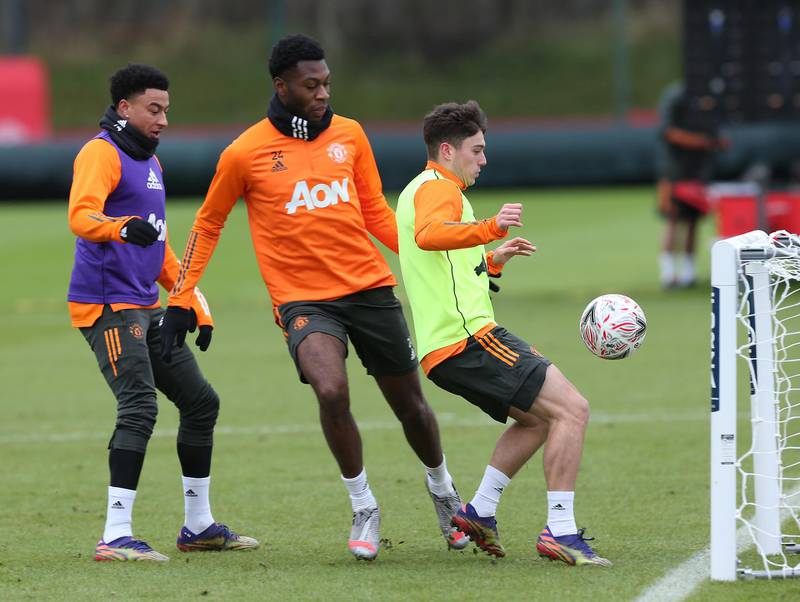 MANCHESTER, ENGLAND - JANUARY 08: (EXCLUSIVE COVERAGE)  Jesse Lingard, Timothy Fosu-Mensah, Daniel James of Manchester United in action during a first team training session at Aon Training Complex on January 08, 2021 in Manchester, England. (Photo by Matthew Peters/Manchester United via Getty Images)