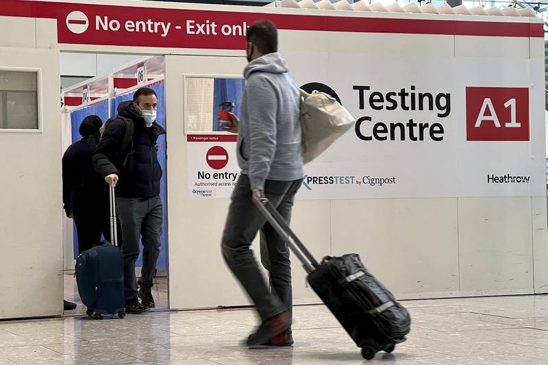 Air passengers get a Covid-19 test at Heathrow Airport. AP
