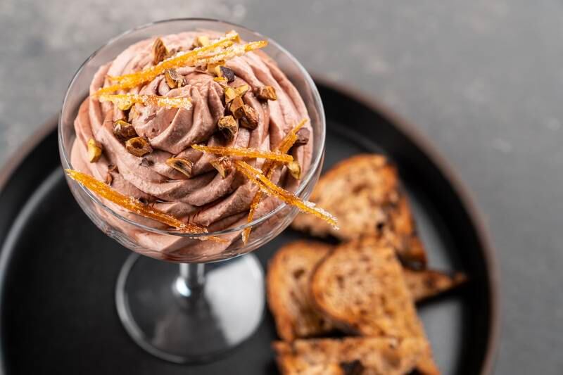 Chicken liver mousse with vincotto, pistachio, candied orange zest and bread, Dh95