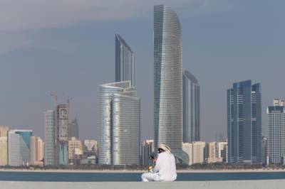 Abu Dhabi, United Arab Emirates, February 8, 2017:    An Emirati man uses his smartphone while drinking coffee on the breakwater along the corniche in Abu Dhabi on February 8, 2017. Christopher Pike / The National

Job ID: 
Reporter:  N/A
Section: News
Keywords: possible focal point *** Local Caption ***  CP0208-Na-standalone-03.JPG