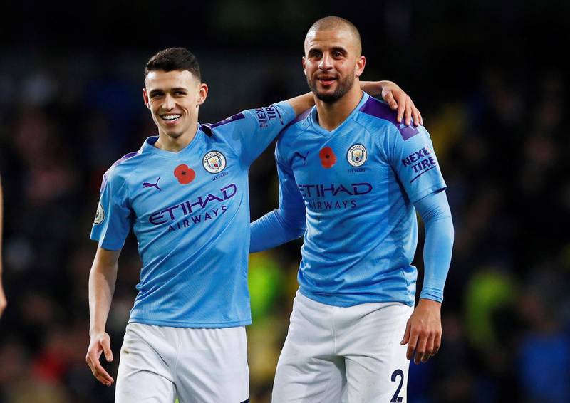 Soccer Football - Premier League - Manchester City v Southampton - Etihad Stadium, Manchester, Britain - November 2, 2019  Manchester City's Kyle Walker and Phil Foden celebrate after the match   Action Images via Reuters/Jason Cairnduff  EDITORIAL USE ONLY. No use with unauthorized audio, video, data, fixture lists, club/league logos or "live" services. Online in-match use limited to 75 images, no video emulation. No use in betting, games or single club/league/player publications.  Please contact your account representative for further details.
