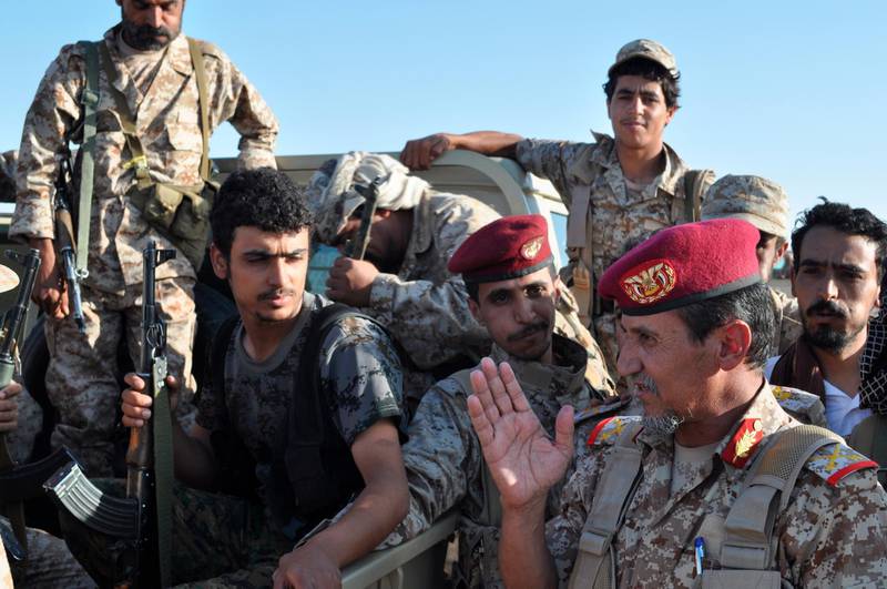 FILE - In this Sept. 14, 2015, file photo, Yemeni Gen. Abd al-Rab Qassim al-Shadadi speaks to his troops at a United Arab Emirates military base near Saffer, Yemen. The United Arab Emirates has drawn down the number of its troops in Yemen, but has not withdrawn from the country and remains a key member of the Saudi-led coalition at war there, a senior Emirati official confirmed Monday, July 8, 2019. The official declined to give figures on how many troops have been withdrawn or how many remain in Yemen, but said the UAE remains committed to the Saudi-led coalition there. (AP Photo/Adam Schreck, File)