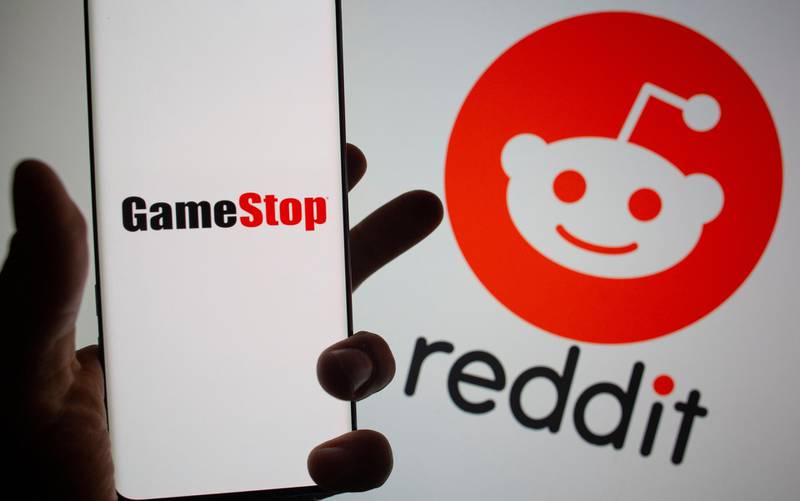 GameStop logo is seen in front of displayed Reddit logo in this illustration taken February 2, 2021. REUTERS/Dado Ruvic/Illustration