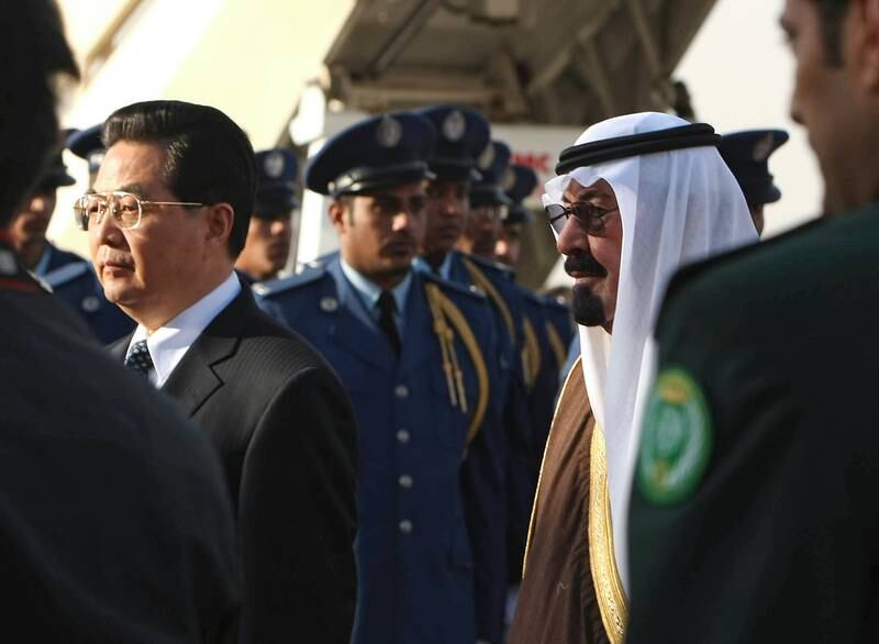 King Abdullah and Mr Hu review a guard of honour upon the Chinese president's arrival at Riyadh airport in February 2009.