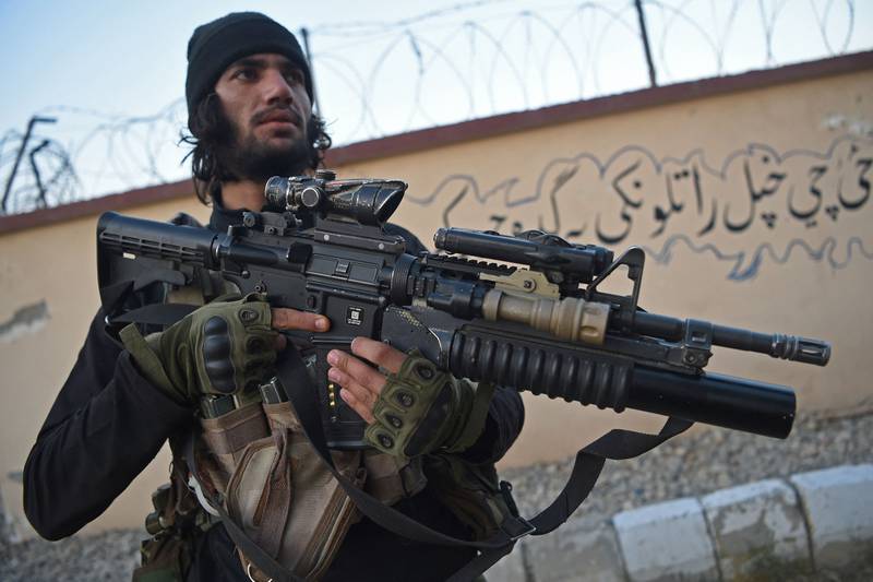 A member of the Taliban forces stands guard at the provincial intelligence compound in Jalalabad. AFP