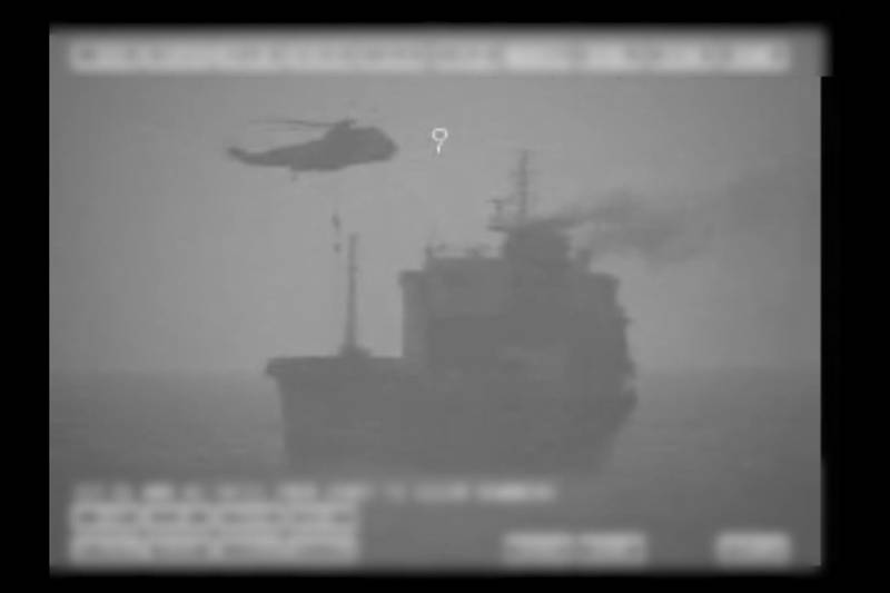 In this image made from video released by the U.S. military's Central Command, Iranian commandos fast-rope down from a helicopter onto the MV Wila oil tanker in the Gulf of Oman off the coast of the United Arab Emirates on Wednesday, Aug. 12, 2020. The Iranian navy boarded and briefly seized the Liberian-flagged oil tanker near the strategic Strait of Hormuz amid heightened tensions between Tehran and the U.S., a U.S. military official said Thursday, Aug. 13, 2020. (U.S. military's Central Command via AP)