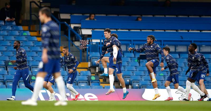 Chelsea players warm up before the match against Brighton. PA