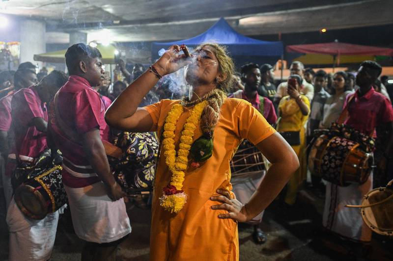 This picture taken on February 7, 2020 shows a Hindu devotee before making her way towards the Batu Caves temple to make offerings during the Thaipusam festival in Batu Caves on the outskirts of Kuala Lumpur. The Hindu festival of Thaipusam, which commemorates the day when Goddess Pavarthi gave her son Lord Muruga an invincible lance with which he destroyed evil demons, is celebrated by some two million ethnic Indians in Malaysia and Singapore. AFP