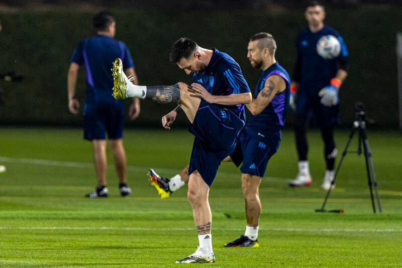 Lionel Messi warms up during a training session in Doha. EPA