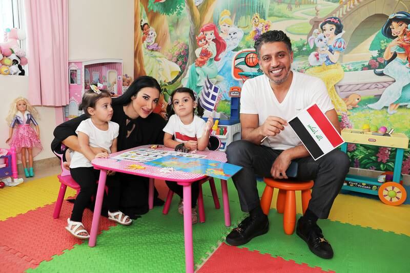 Joanna Bakalou with her daughters Souad, left, and Zein, right, and husband Nabil Alkhashlok at home in Dubai. Zein's mother is Greek and her father is from Iraq.
