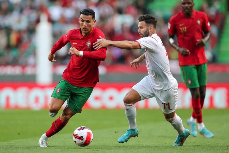 Cristiano Ronaldo tussles for the ball with Switzerland's Renato Steffen. EPA