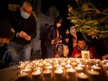 People pay tribute in front of the Notre Dame Basilica on October 29, 2020 in Nice, France. Getty Images