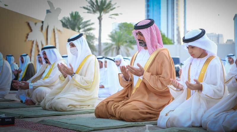 Sheikh Ammar bin Humaid Al Nuaimi, Crown Prince of Ajman, attends prayers at Al Zaher Palace courtyard. Wam