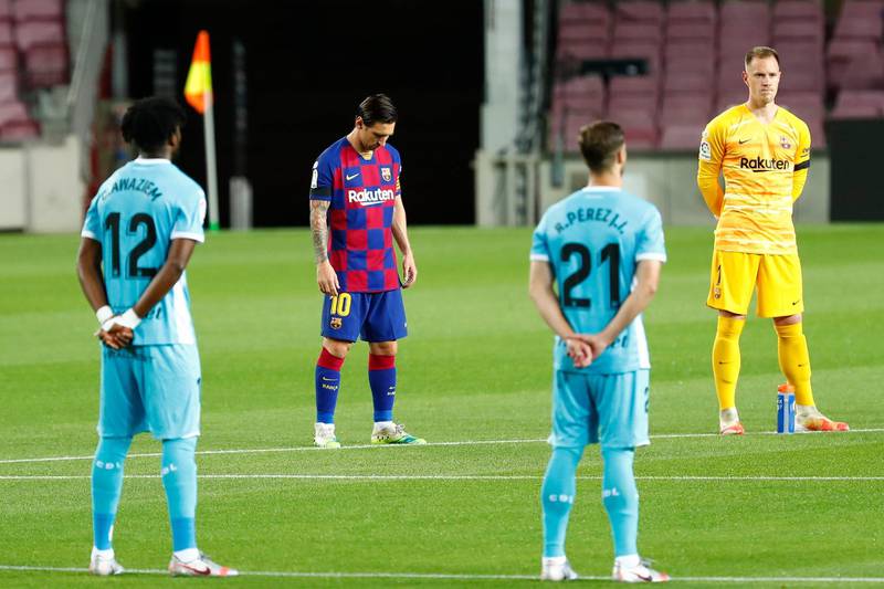 Lionel Messi holds a minute of silence prior to the match. AP Photo