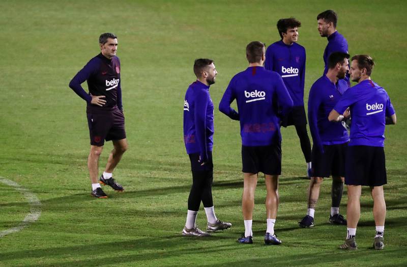 Barcelona manager Ernesto Valverde, left,  with his players during training on Wednesday. Reuters