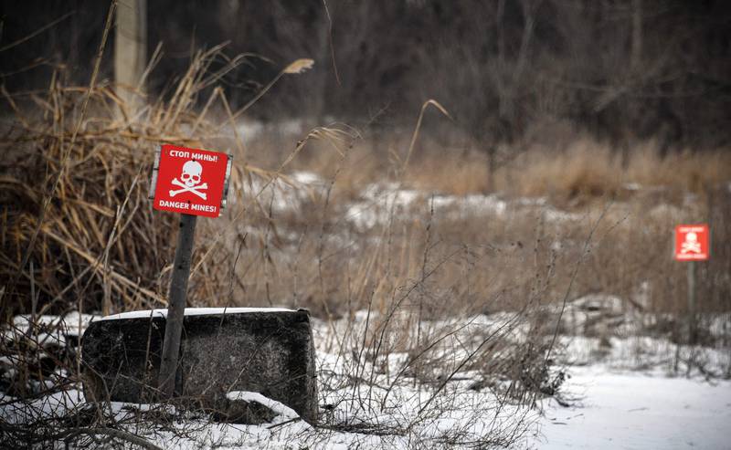 Landmine warning signs in the village of Vesyoloye, Ukraine.  AFP