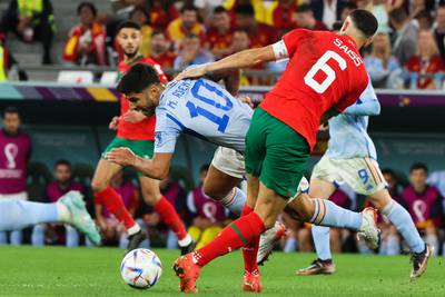 Spain's forward Marco Asensio fights for the ball with Morocco's Romain Ghanem Saiss. AFP