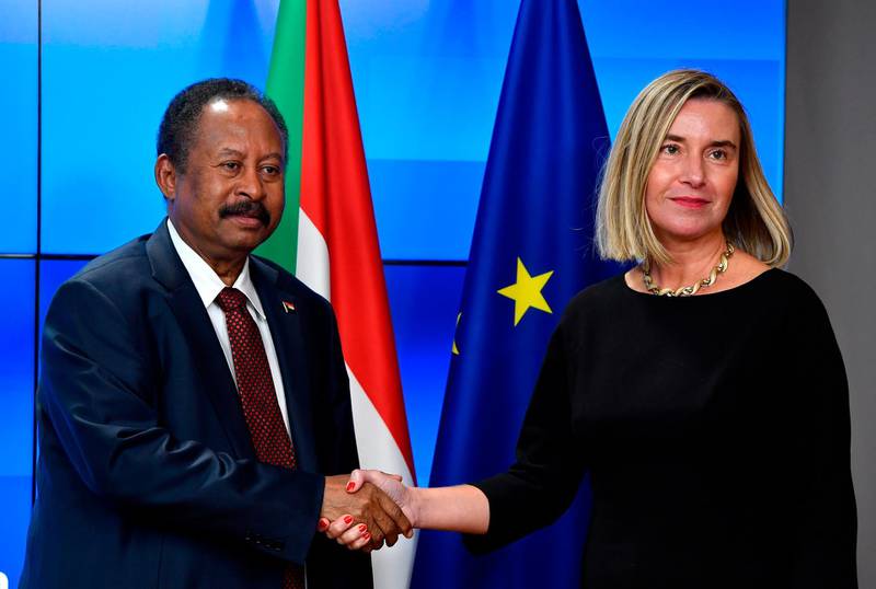 European Union for Foreign Affairs and Security Policy Federica Mogherini (R) welcomes the Prime Minister of Sudan Abdalla Hambok prior to their bilateral meeting at the EU headquarters in Brussels on November 11, 2019. / AFP / JOHN THYS
