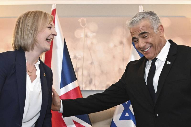 British Prime Minister Liz Truss and Israeli Prime Minister Yair Lapid hold a bilateral meeting on the sidelines of the UN General Assembly in New York, Wednesday, Sept.  21, 2022.  (Toby Melville / Pool Photo via AP)