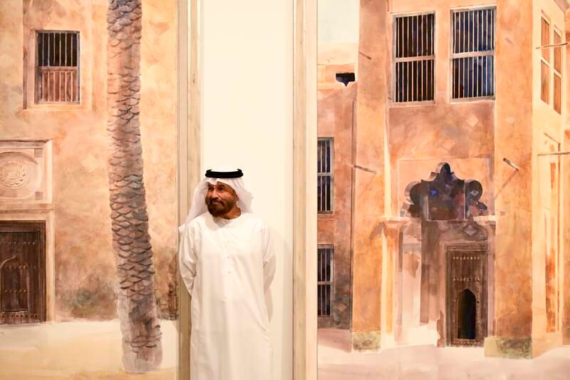 Emirati artist Al Rais with his works
