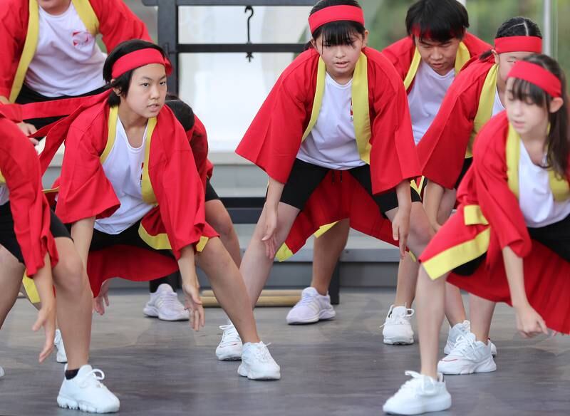 Elementary and junior high school students from the Japanese School in Dubai perform 'Nanchu Soran' – a traditional dance – on Japan Day at Expo 2020 Dubai. All photos: Chris Whiteoak / The National