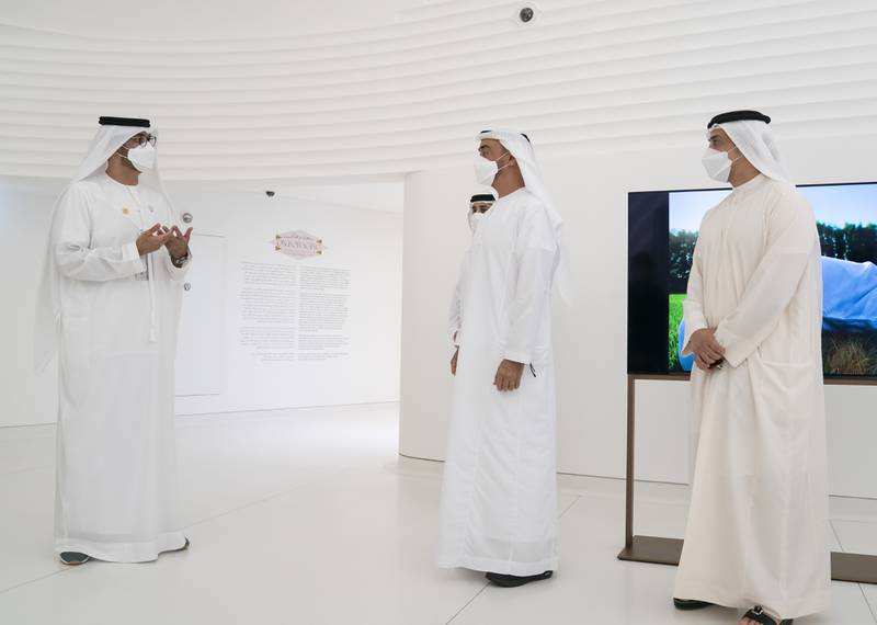Sheikh Mohamed bin Zayed, centre,  at Expo 2020 Dubai with Sheikh Mansour bin Zayed, Deputy Prime Minister and Minister of Presidential Affairs, right, and Dr Sultan Al Jaber, left.