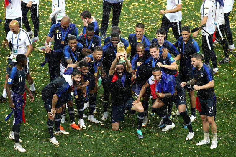 MOSCOW, RUSSIA - JULY 15:  Adil Rami of France and his teammates celebrate with the World Cup Trophy following their sides victory in the 2018 FIFA World Cup Final between France and Croatia at Luzhniki Stadium on July 15, 2018 in Moscow, Russia.  (Photo by Catherine Ivill/Getty Images)